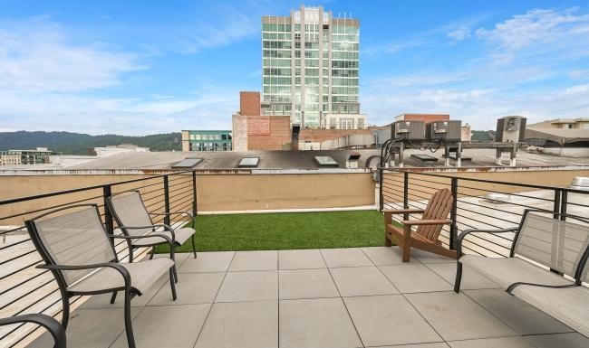 a group of chairs on a rooftop
